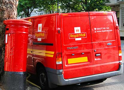 Image of post office van next to postbox