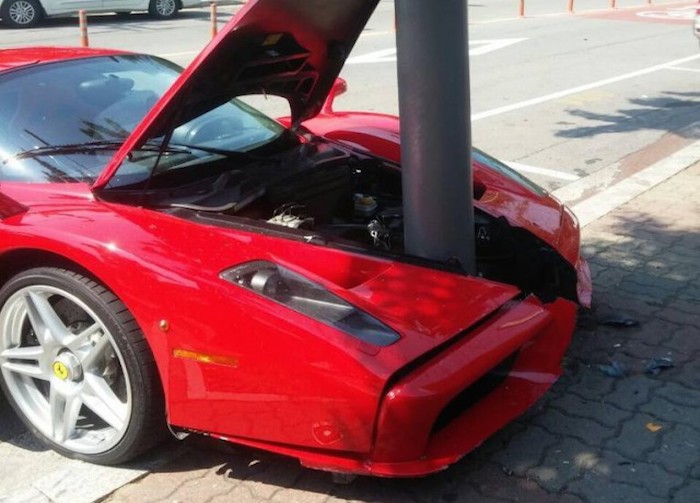Image of a Ferrari driven into a lampost