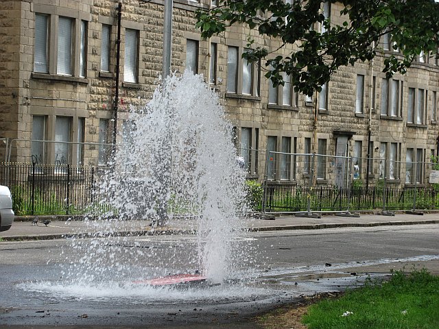 Image of a burst water main.